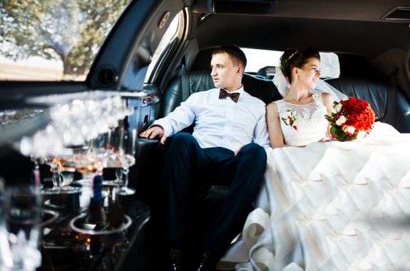 Couple enjoying a luxurious and comfortable ride in a limousine in Valley Center, CA.